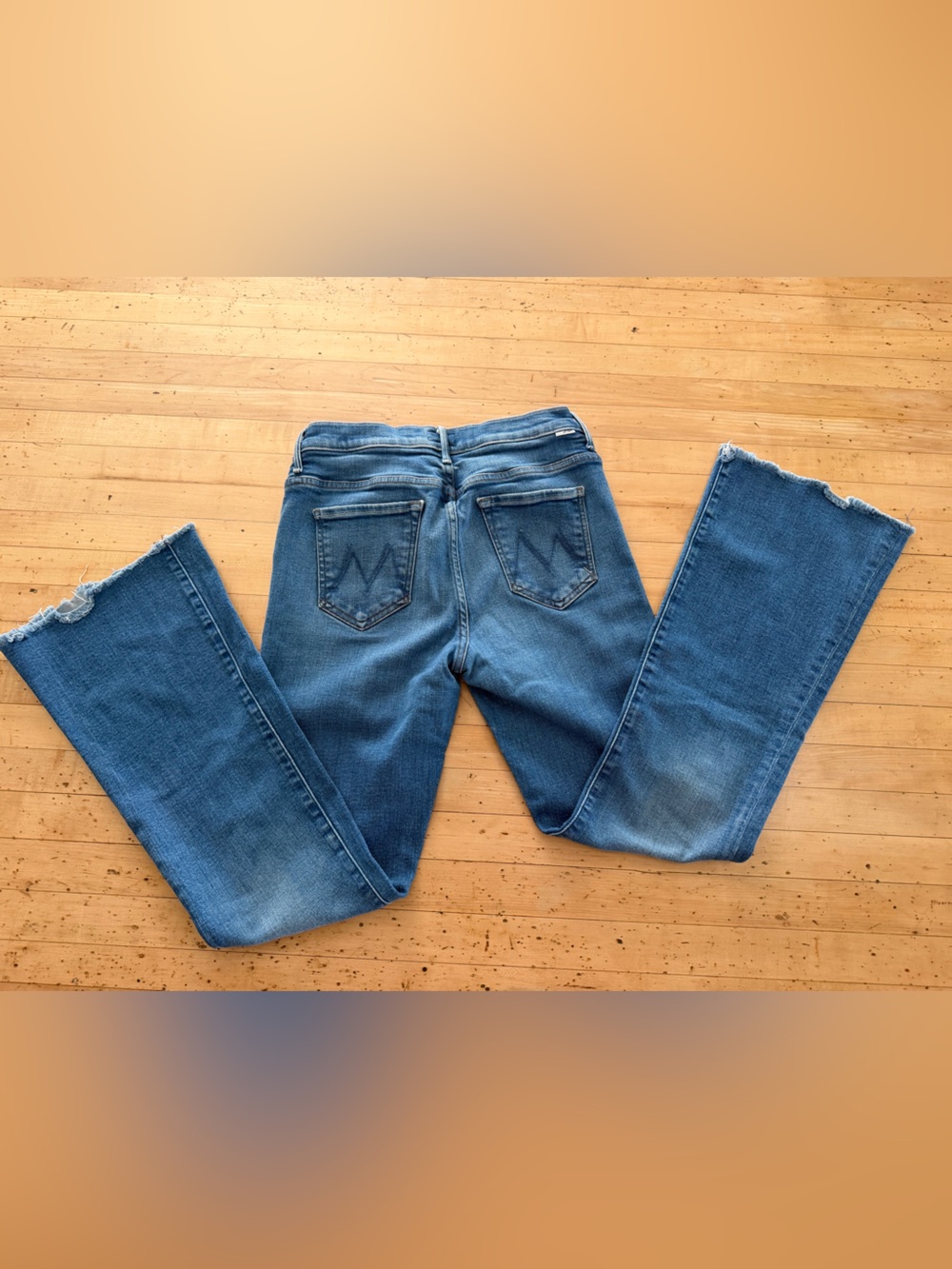 MOTHER Blue Flare Jeans with Distressed Hem